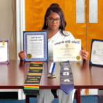 student displaying their certificates and achievements before graduation